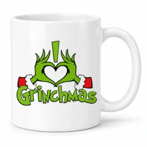 Taza blanca navideña con manos verdes del Grinch formando un corazón y texto Grinchmas.